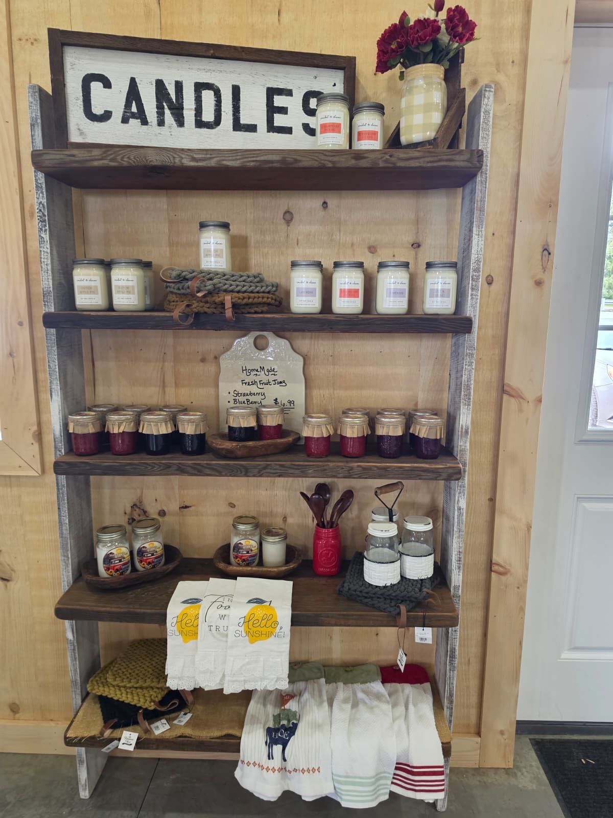Candles, jams, and linens on the country store shelf