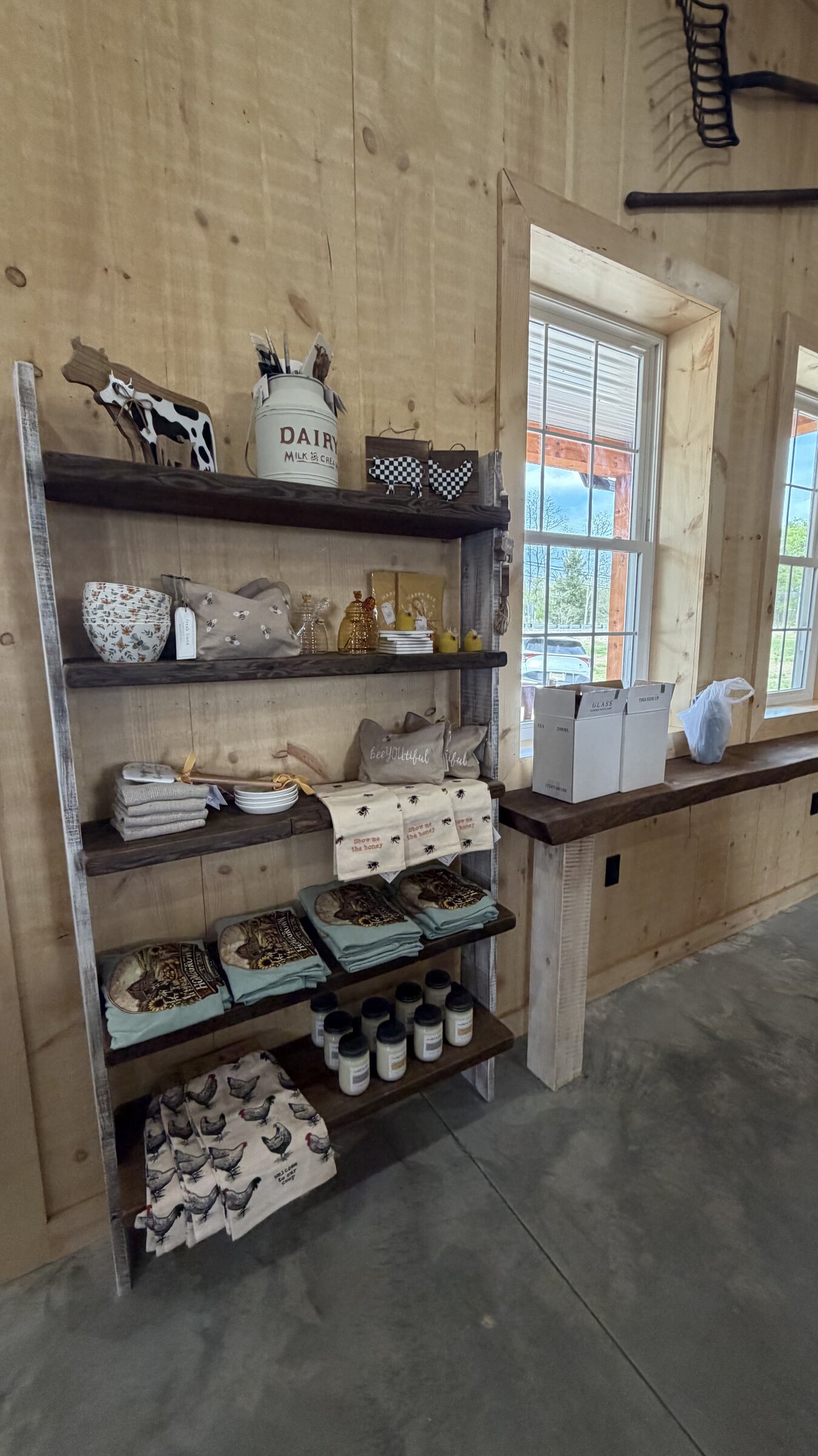 Rustic shelves with dairy and bee-themed kitchen goods