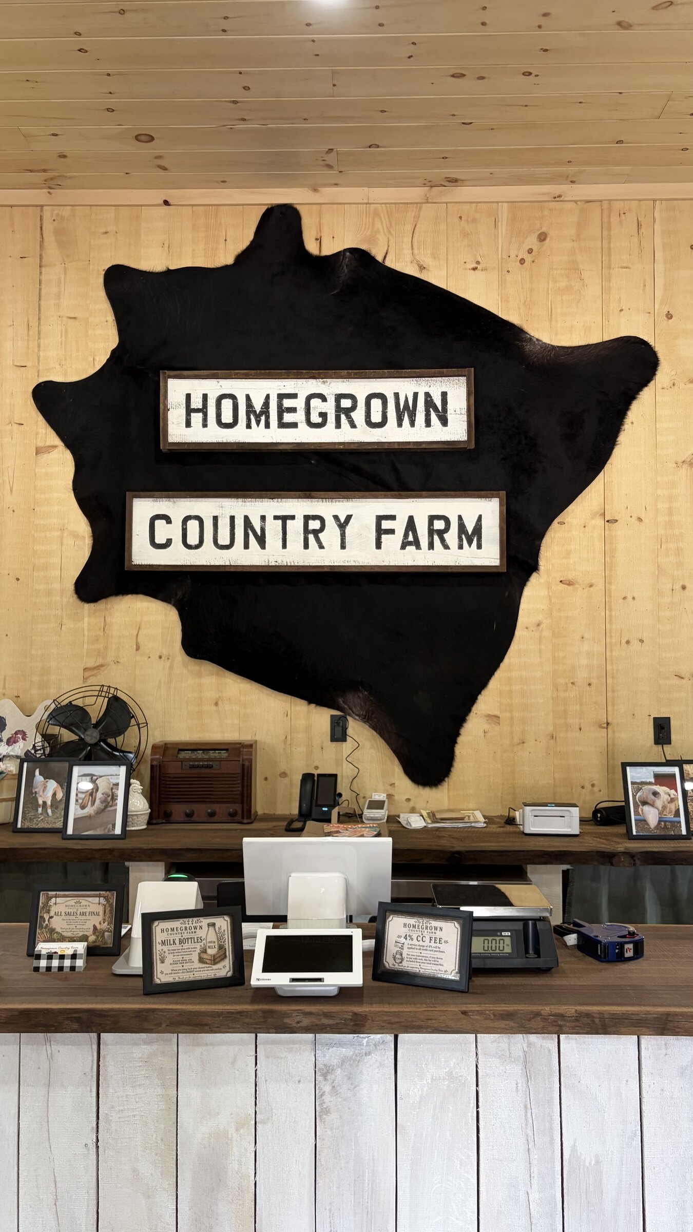 Homegrown Country Farm checkout counter with vintage signs and cowhide