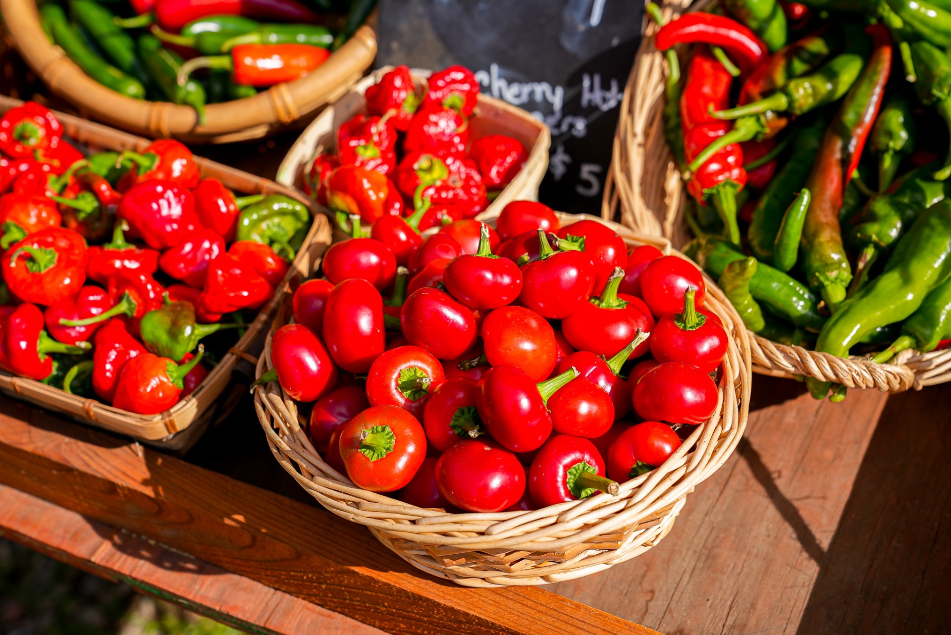 Baskets of fresh red and green peppers